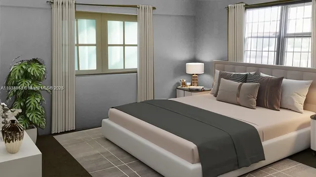 a bedroom with a bed and a potted plant