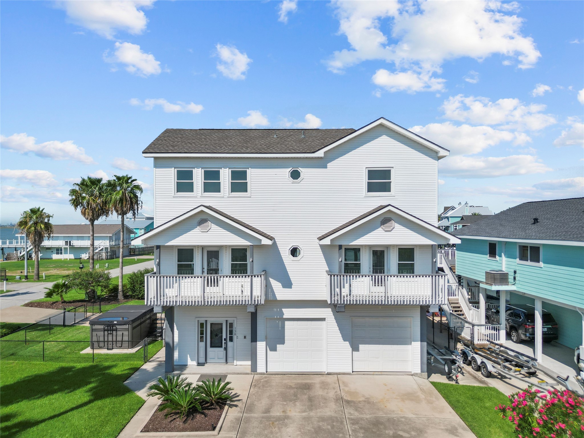 138 Isles End Road Galveston, TX 77554 - Photo 1 of 36 a front view of a house with a garden and plants