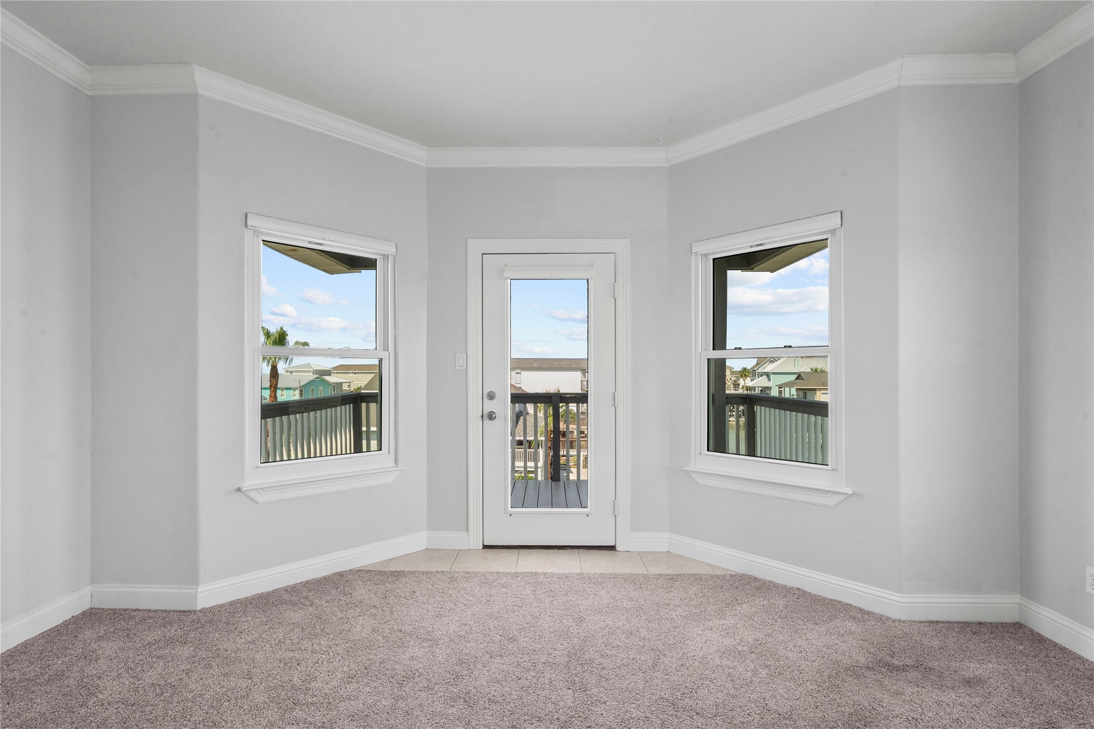 138 Isles End Road Galveston, TX 77554 - Photo 28 of 36 an empty room with windows and entrance