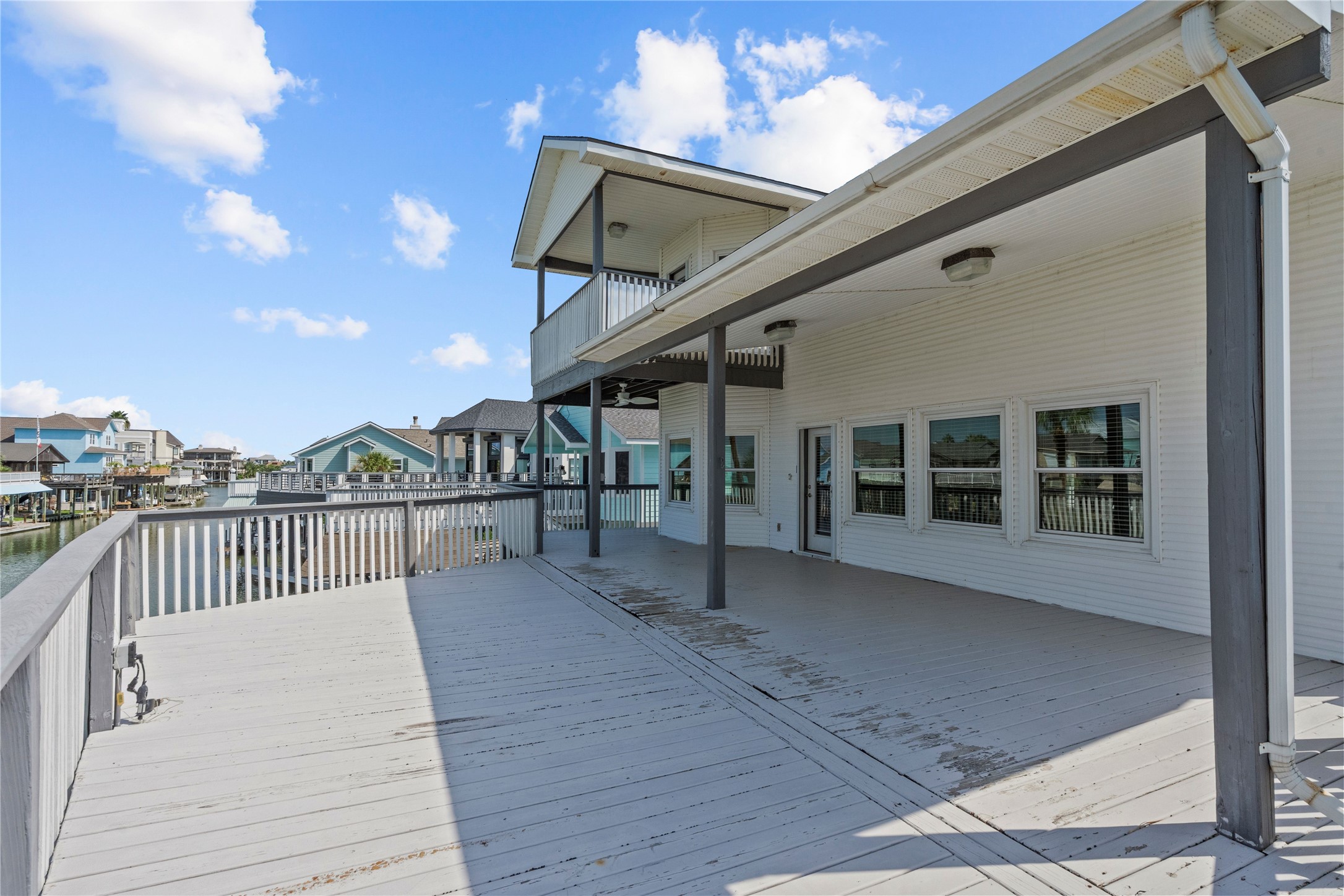 138 Isles End Road Galveston, TX 77554 - Photo 32 of 36 a view of a house with a roof deck
