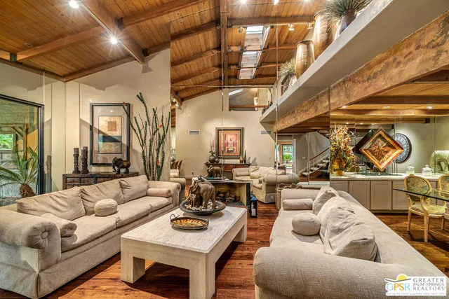a bathroom with a granite countertop sink vanity and mirror