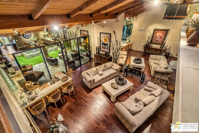 a front view of a house with a yard and a garage