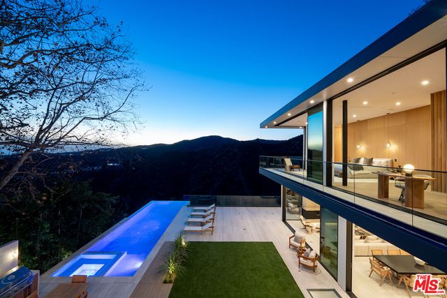 a view of swimming pool with a yard