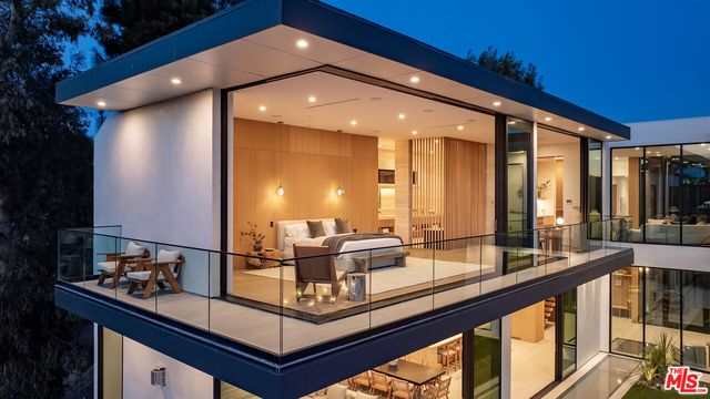 a view of swimming pool with outdoor seating