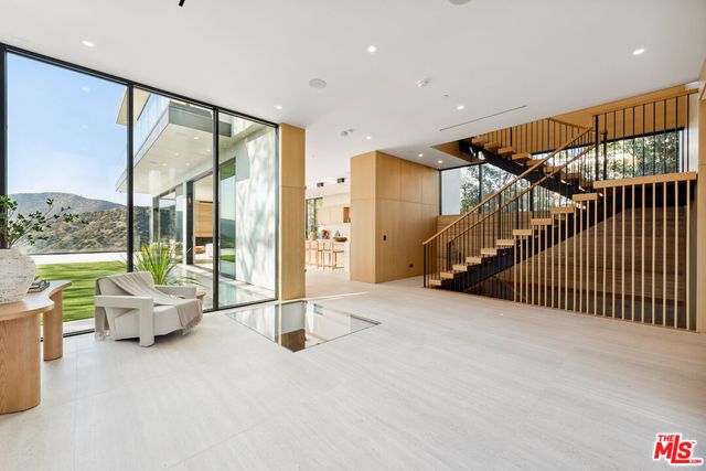 a view of livingroom with furniture and floor to ceiling window