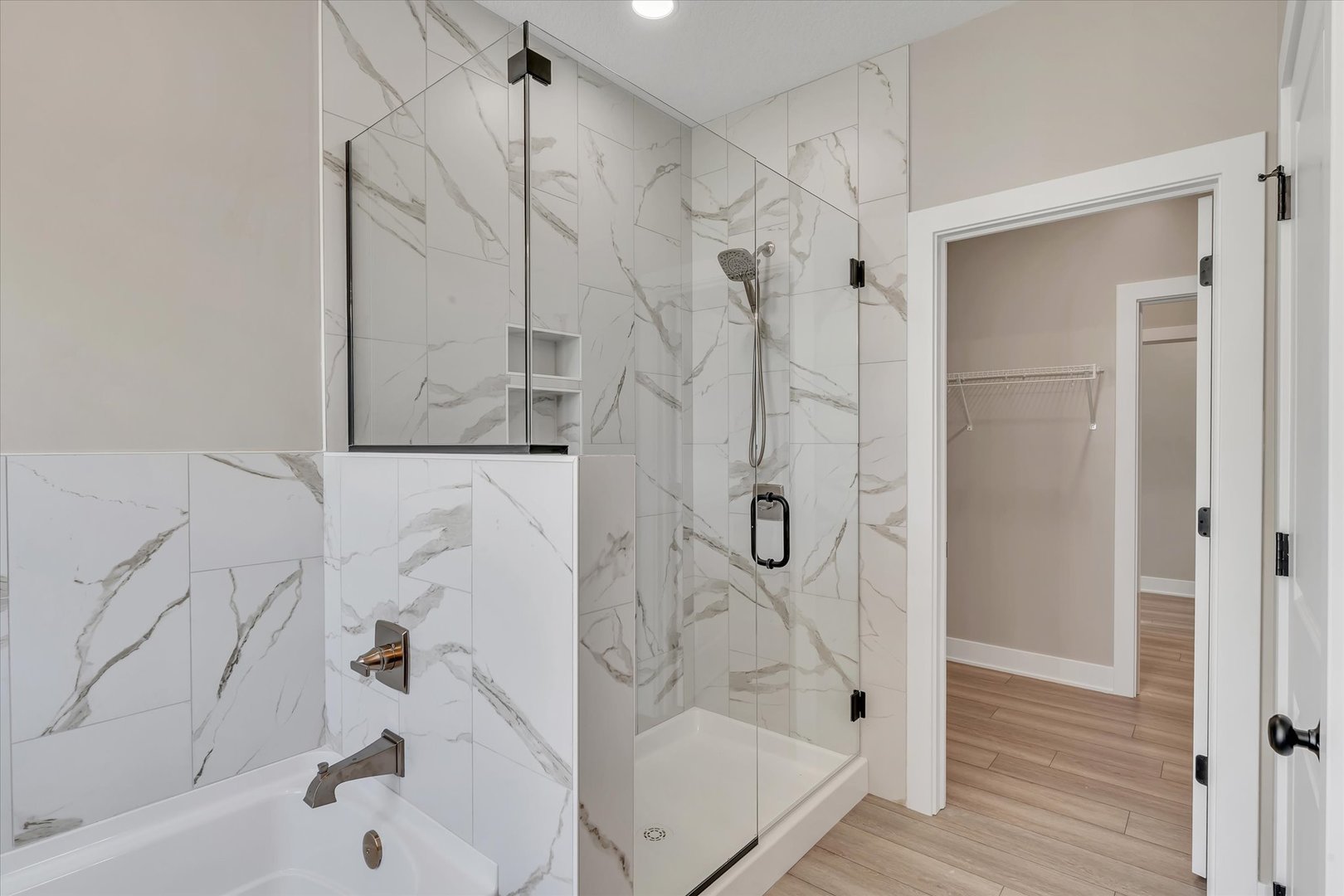 455 Rhonda Road New Liberty, IA 52765 - Photo 36 of 54 a bathroom with a bathtub and a shower