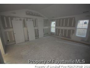 209 Culpepper Road Cameron, NC 28326 - Photo 11 of 17 a view of an empty room with a window