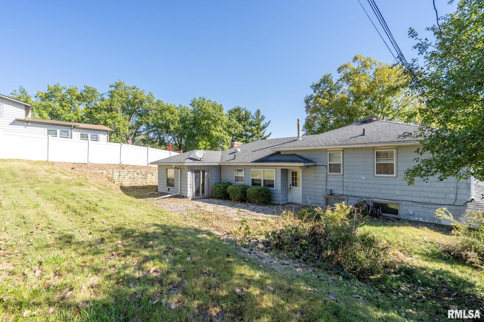 2552 37th Avenue Rock Island, IL 61201 - Photo 25 of 33 a front view of a house with a yard