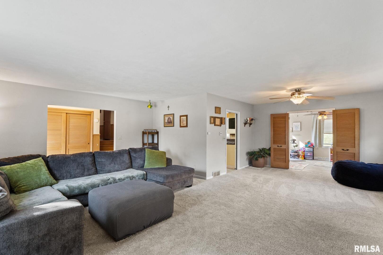 2552 37th Avenue Rock Island, IL 61201 - Photo 6 of 33 a living room with furniture and a couch