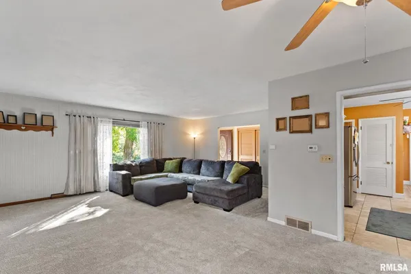 a living room with furniture and a window