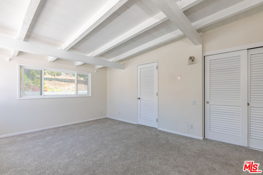 25408 Malibu Road, Unit 1/2 Malibu, CA 90265 - Photo 14 of 19 an empty room with windows