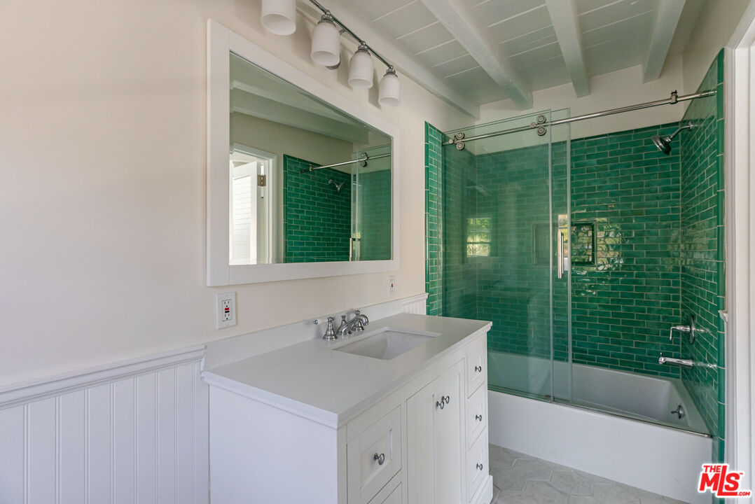 25408 Malibu Road, Unit 1/2 Malibu, CA 90265 - Photo 15 of 19 a bathroom with a sink mirror toilet and bathtub