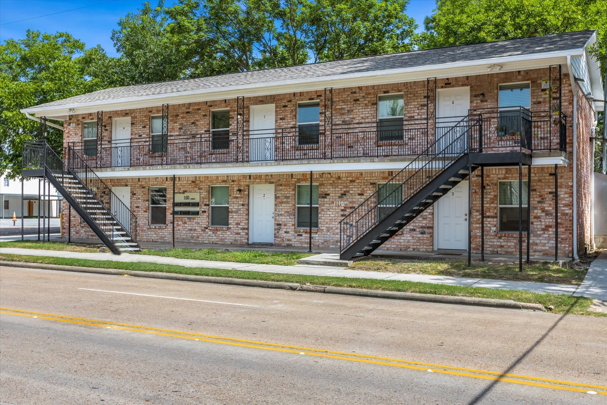 1110 West Patton Street, Unit 4 Houston, TX 77009 - Photo 2 of 8 a front view of a house with a yard