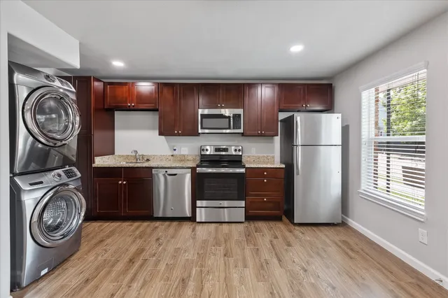 a kitchen with sink a washer and dryer