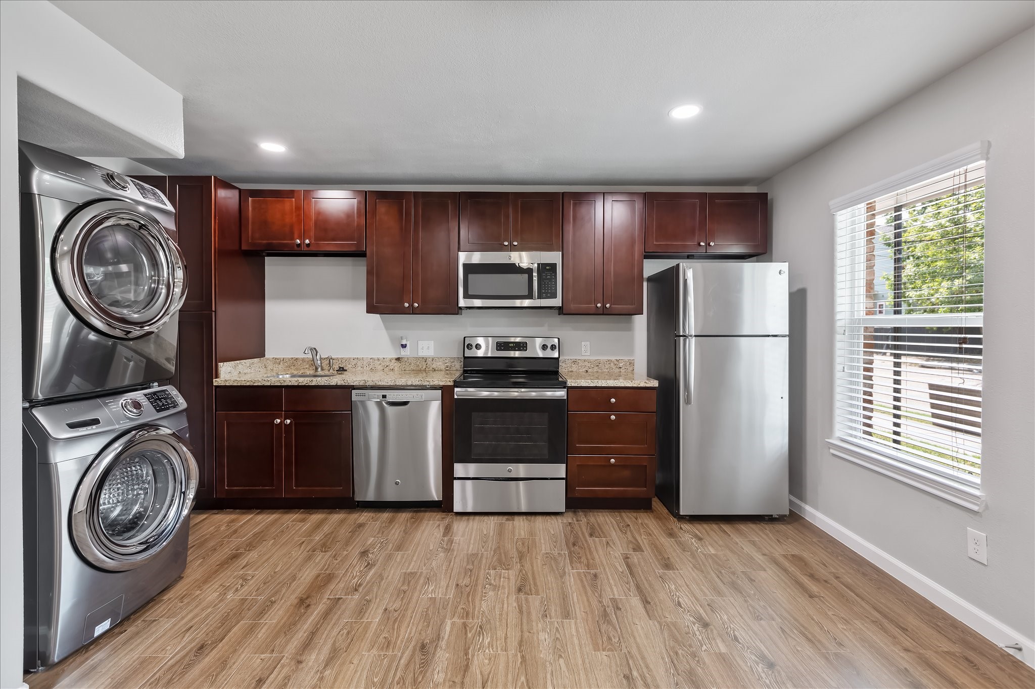 1110 West Patton Street, Unit 4 Houston, TX 77009 - Photo 4 of 8 a kitchen with sink a washer and dryer