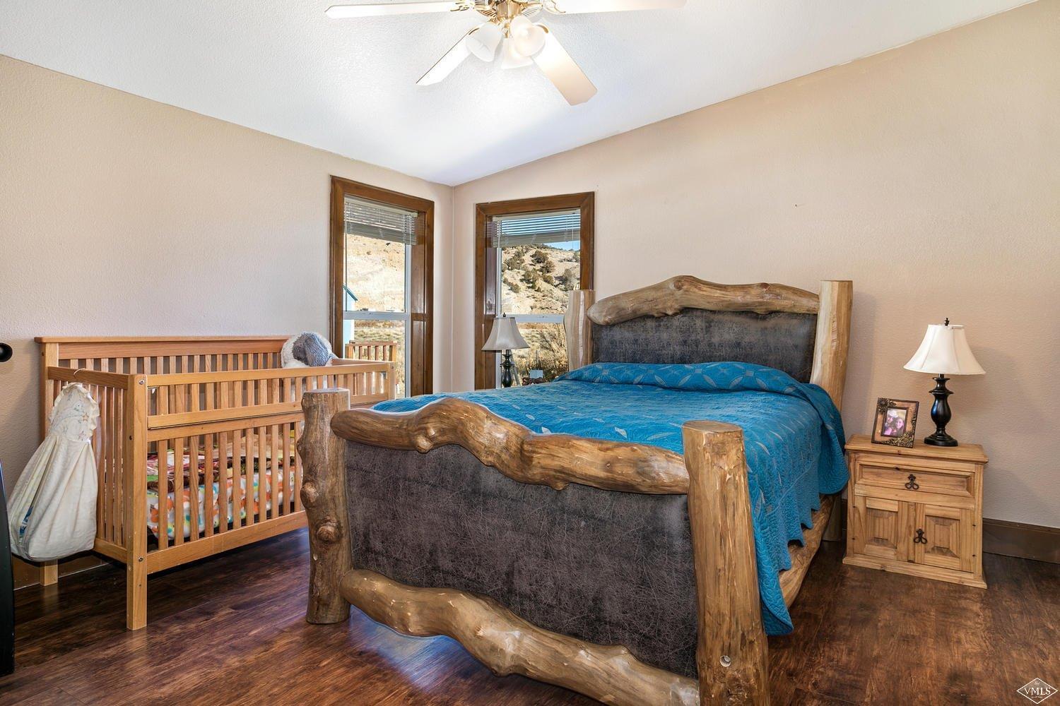 102 Cut Throat Loop Gypsum, CO 81637 - Photo 11 of 25 a bedroom with a bed and a window