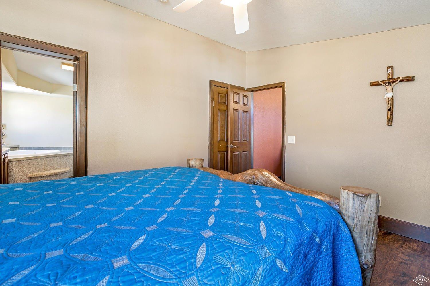 102 Cut Throat Loop Gypsum, CO 81637 - Photo 12 of 25 a bedroom with a bed and painting on the wall