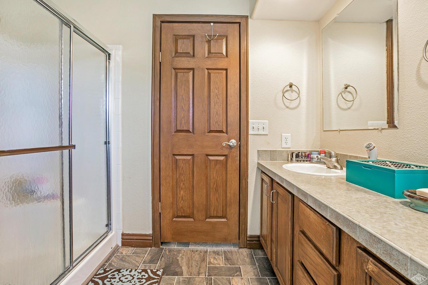 102 Cut Throat Loop Gypsum, CO 81637 - Photo 14 of 25 a bathroom with a sink and a mirror