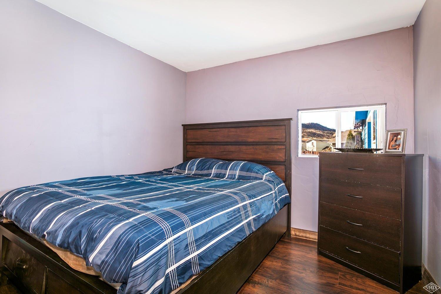 102 Cut Throat Loop Gypsum, CO 81637 - Photo 15 of 25 a bedroom with a bed and a dresser