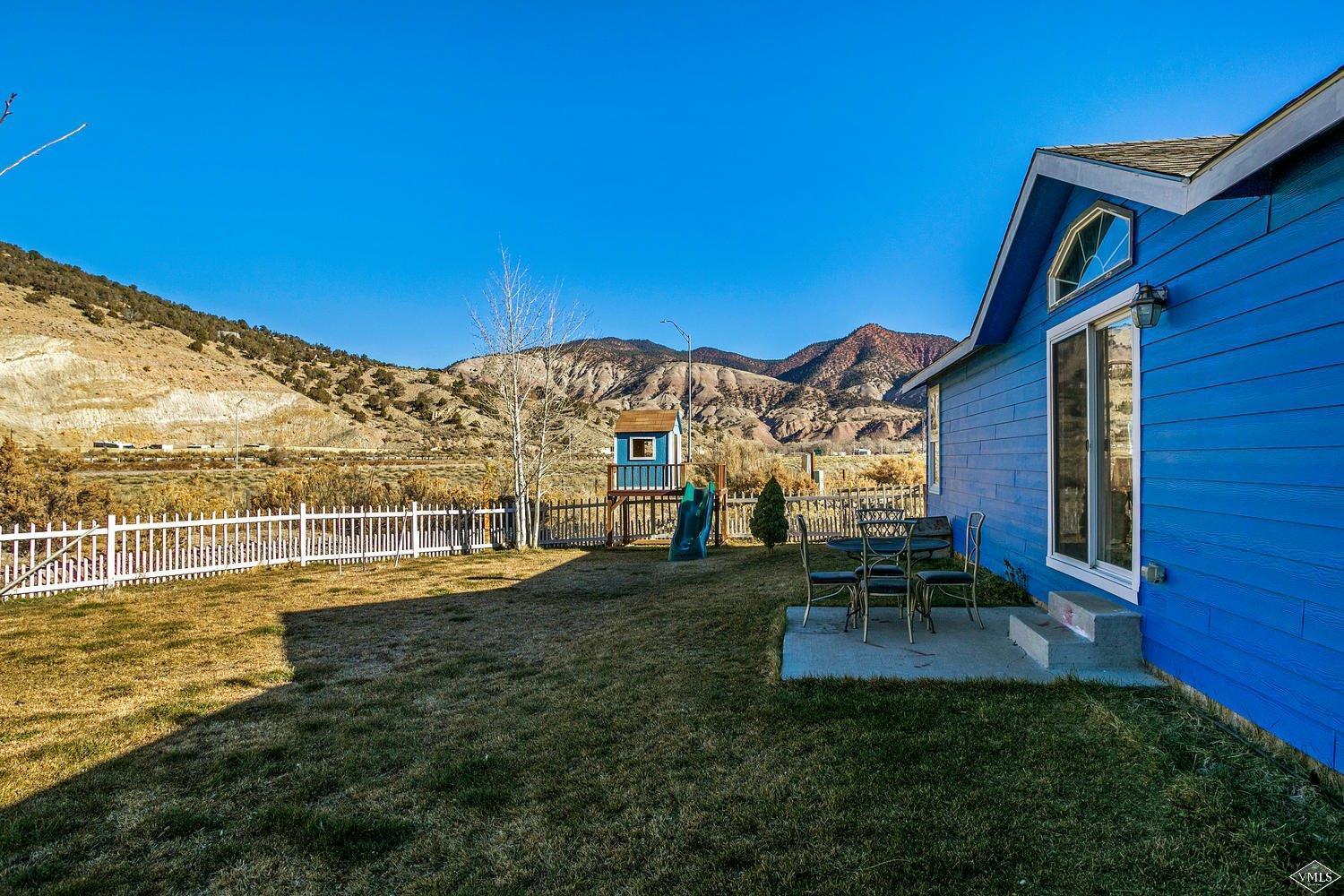 102 Cut Throat Loop Gypsum, CO 81637 - Photo 19 of 25 a view of a swimming pool with a table and chairs