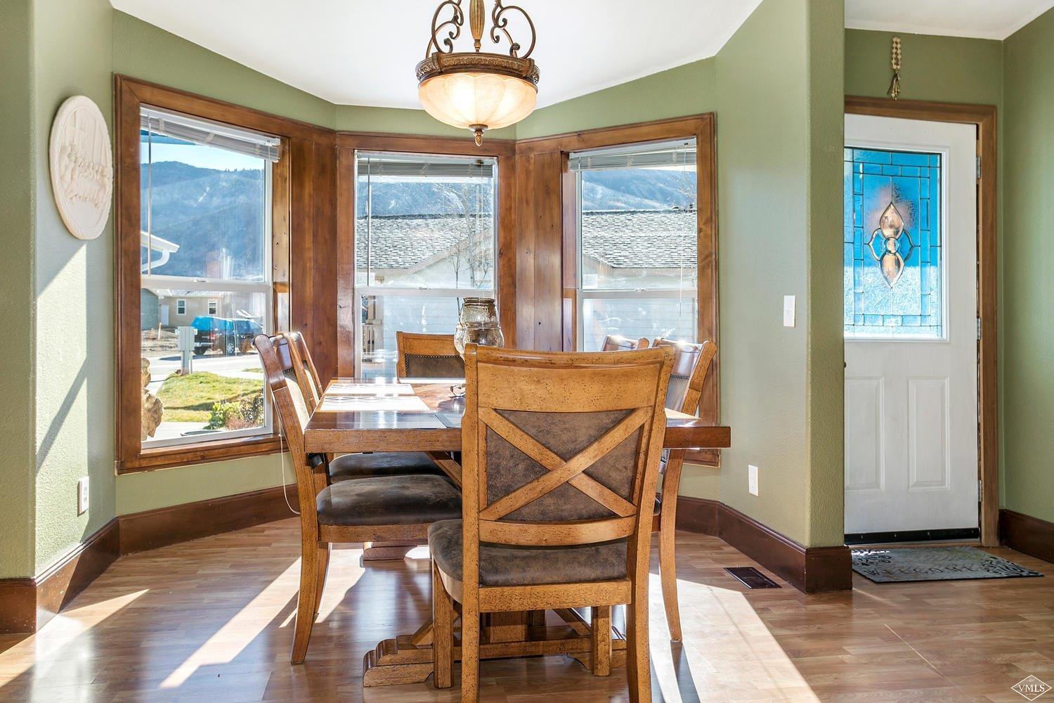 102 Cut Throat Loop Gypsum, CO 81637 - Photo 6 of 25 a view of a dining room with furniture window and wooden floor