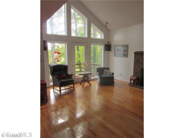 671 Lake Lemar Road Reidsville, NC 27320 - Photo 8 of 16 Living Room. Floor to ceiling windows gleaming HWD floors and a masonary FP with gas logs