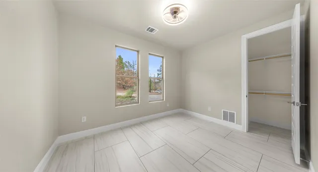 a view of an empty walk in closet