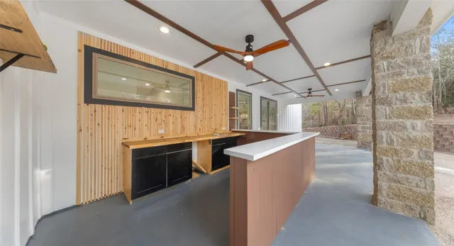 a view of a room with wooden walls