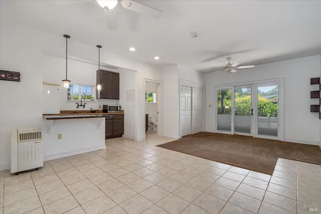 a view of a livingroom with furniture and an entryway