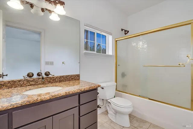 en empty room with windows and outdoor view