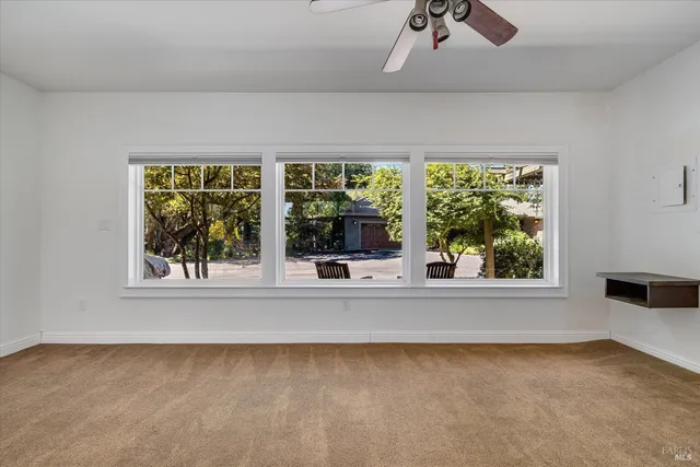 a view of a house with backyard and garden
