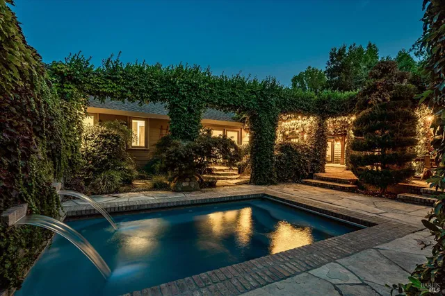 a view of a swimming pool with an outdoor seating