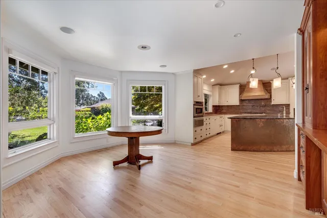 a view of kitchen with a sink and wooden floor