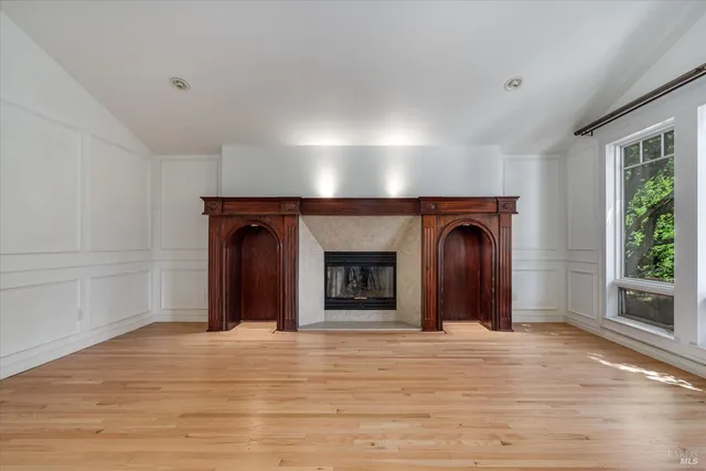 a kitchen with stainless steel appliances kitchen island granite countertop a refrigerator and cabinets