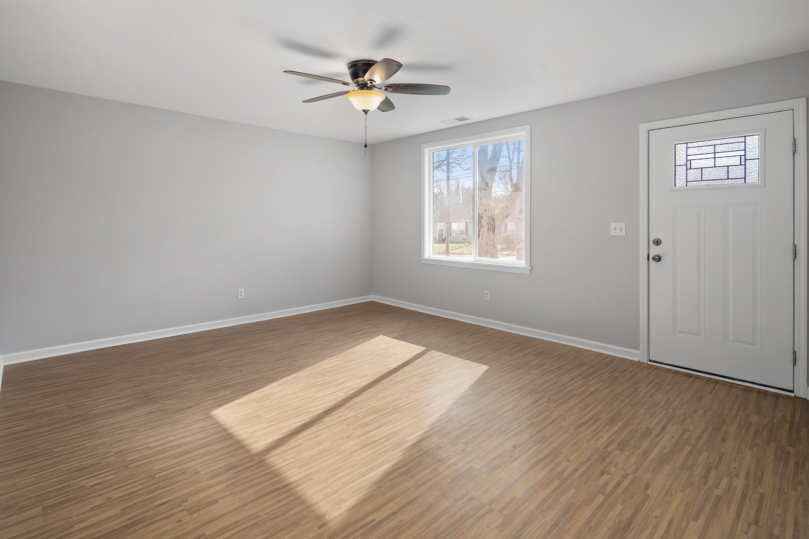 209 Manzano Road Madison, TN 37115 - Photo 5 of 15 a view of empty room with wooden floor and fan