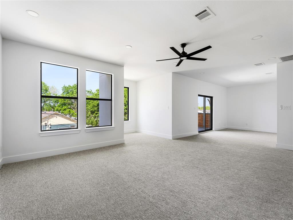 1958 Toronto Street Dallas, TX 75212 - Photo 15 of 32 an empty room with windows and ceiling fan