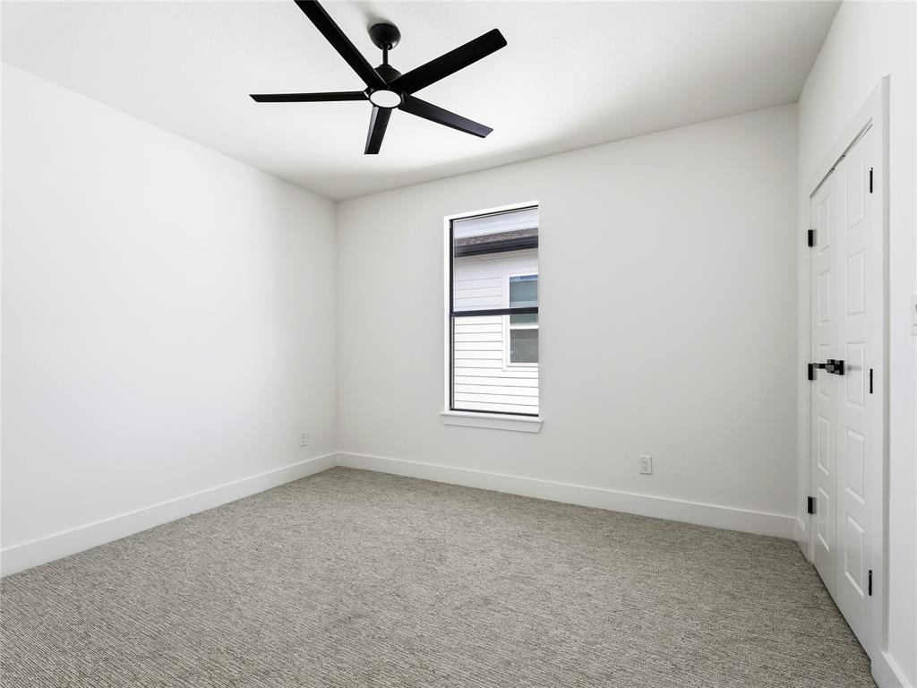 1958 Toronto Street Dallas, TX 75212 - Photo 20 of 32 an empty room with a window and a fan