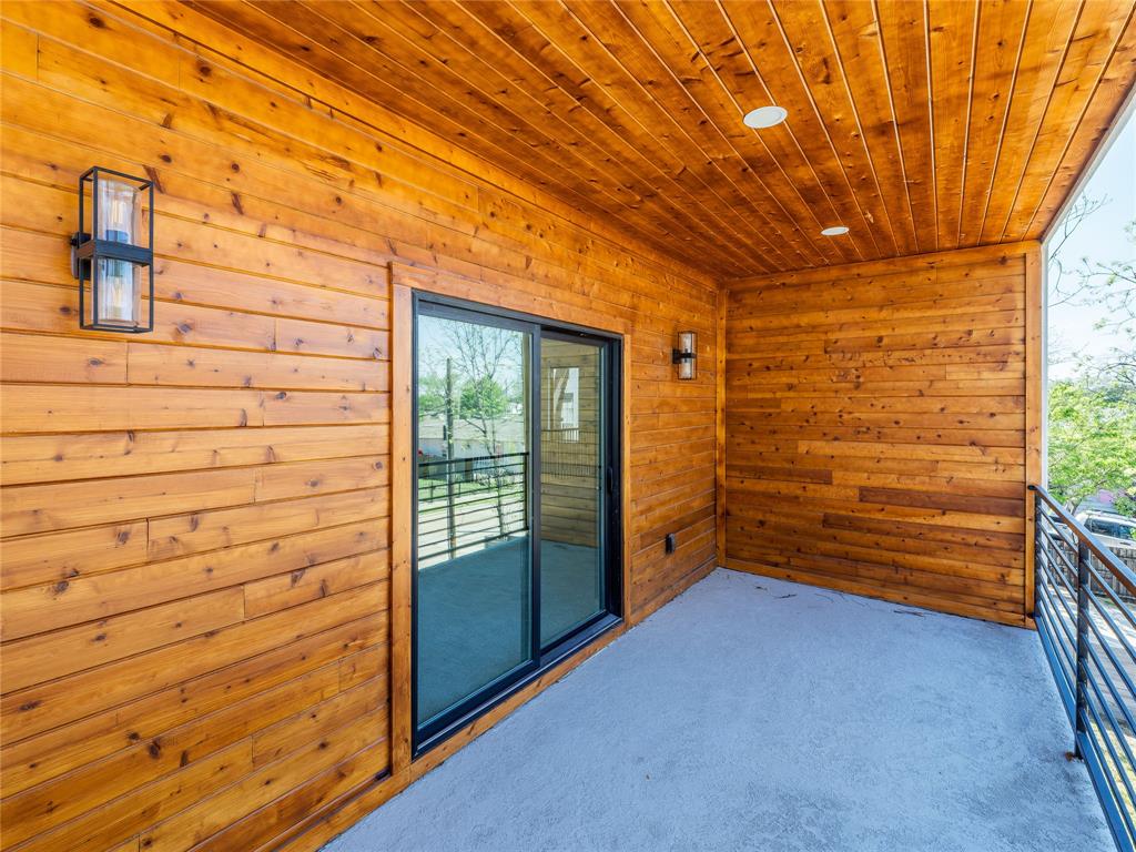 1958 Toronto Street Dallas, TX 75212 - Photo 22 of 32 a view of a room with wooden walls and windows