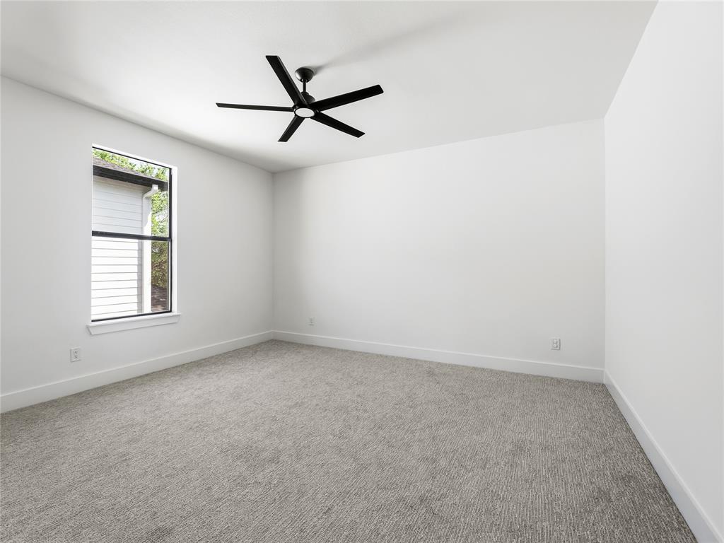1958 Toronto Street Dallas, TX 75212 - Photo 26 of 32 an empty room with a window and a fan