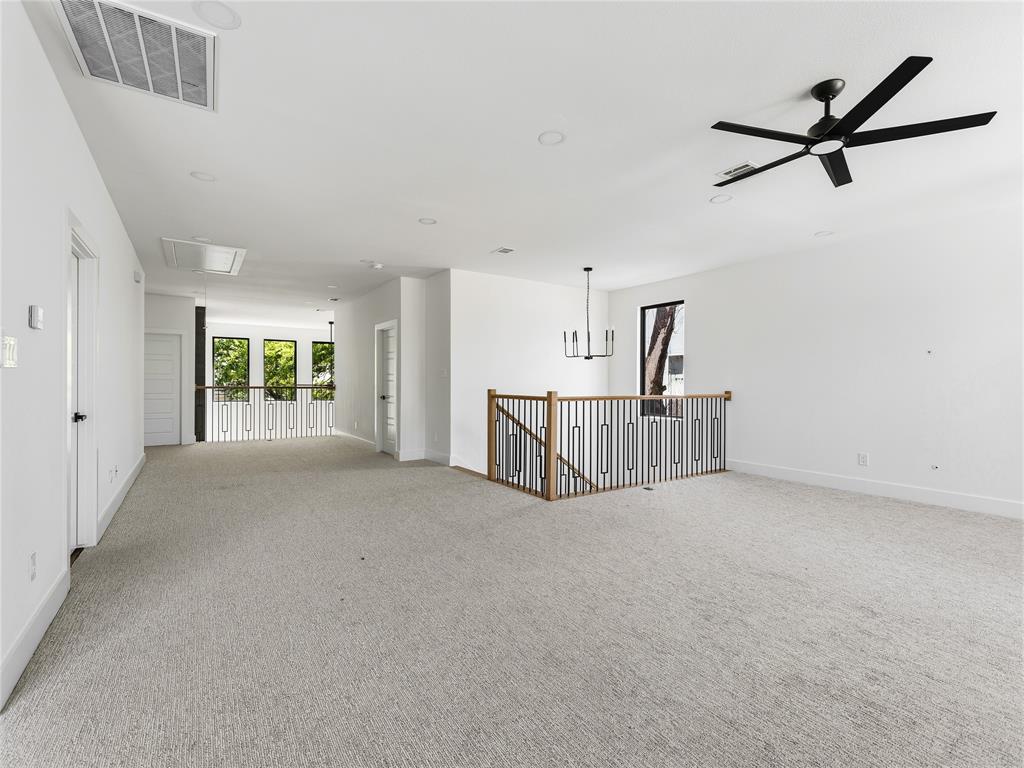 1958 Toronto Street Dallas, TX 75212 - Photo 27 of 32 a view of a livingroom with a ceiling fan and window