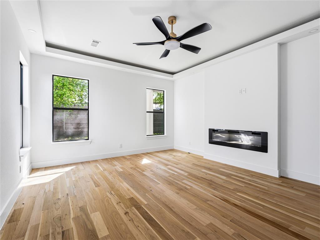 1958 Toronto Street Dallas, TX 75212 - Photo 9 of 32 a view of empty room with wooden floor and fan