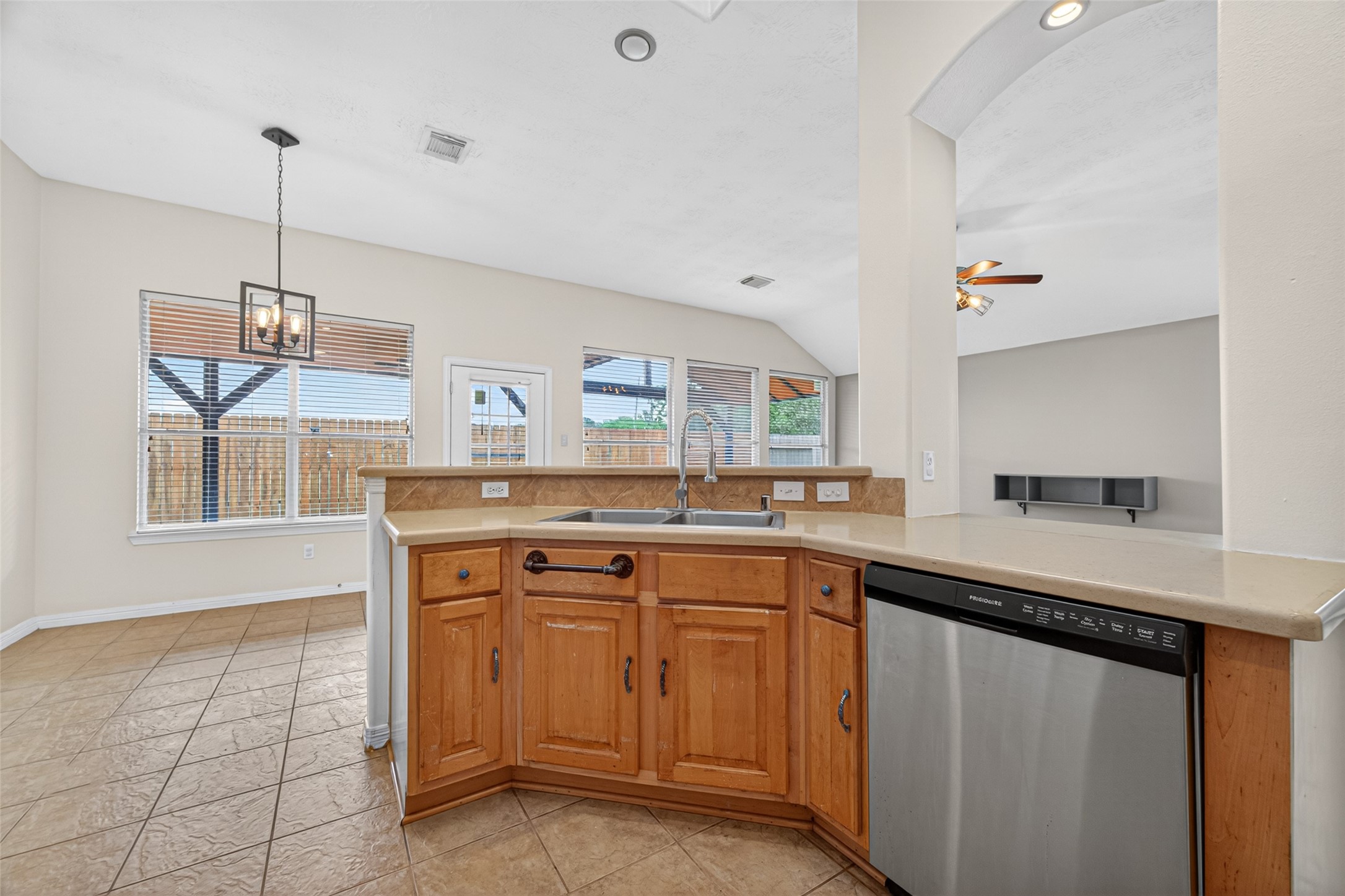 23914 Glengate Drive Spring, TX 77373 - Photo 16 of 49 a kitchen with a sink a counter space appliances and cabinets
