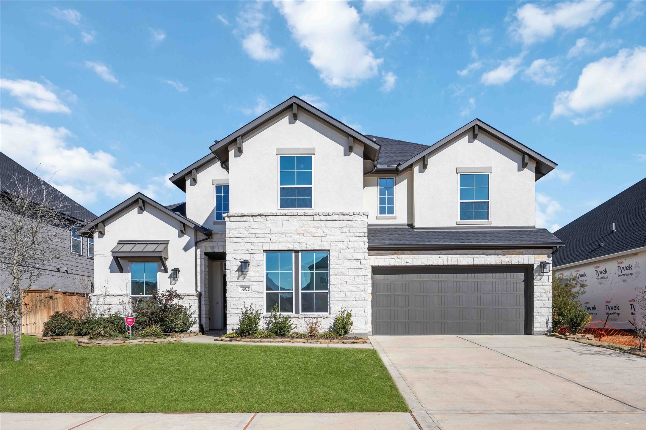 32022 Western Grv Lane Fulshear, TX 77441 - Photo 1 of 49 a front view of a house with a yard and garage