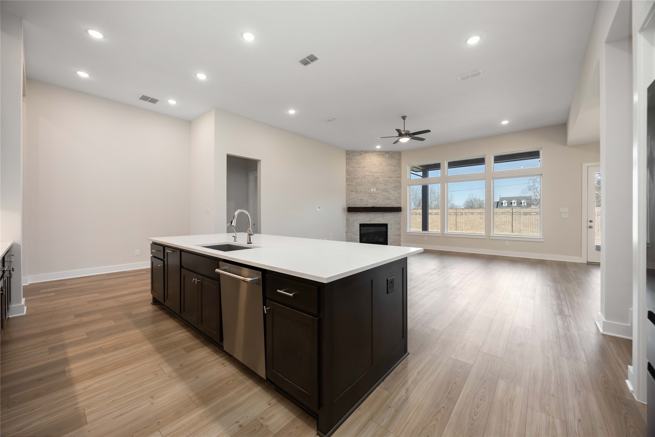 32022 Western Grv Lane Fulshear, TX 77441 - Photo 13 of 49 a kitchen with a stove and a wooden floor