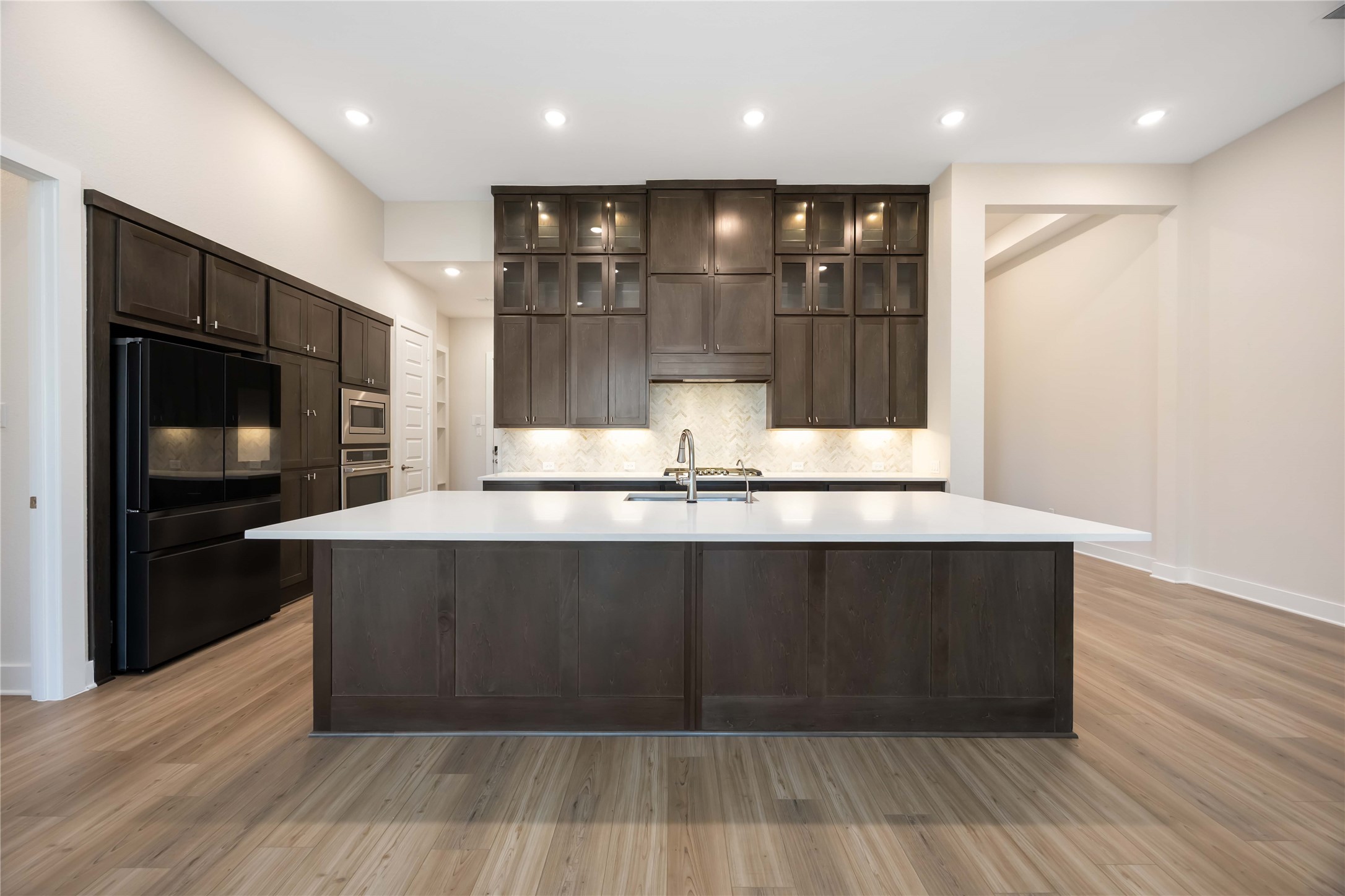 32022 Western Grv Lane Fulshear, TX 77441 - Photo 14 of 49 a large kitchen with stainless steel appliances a large counter top