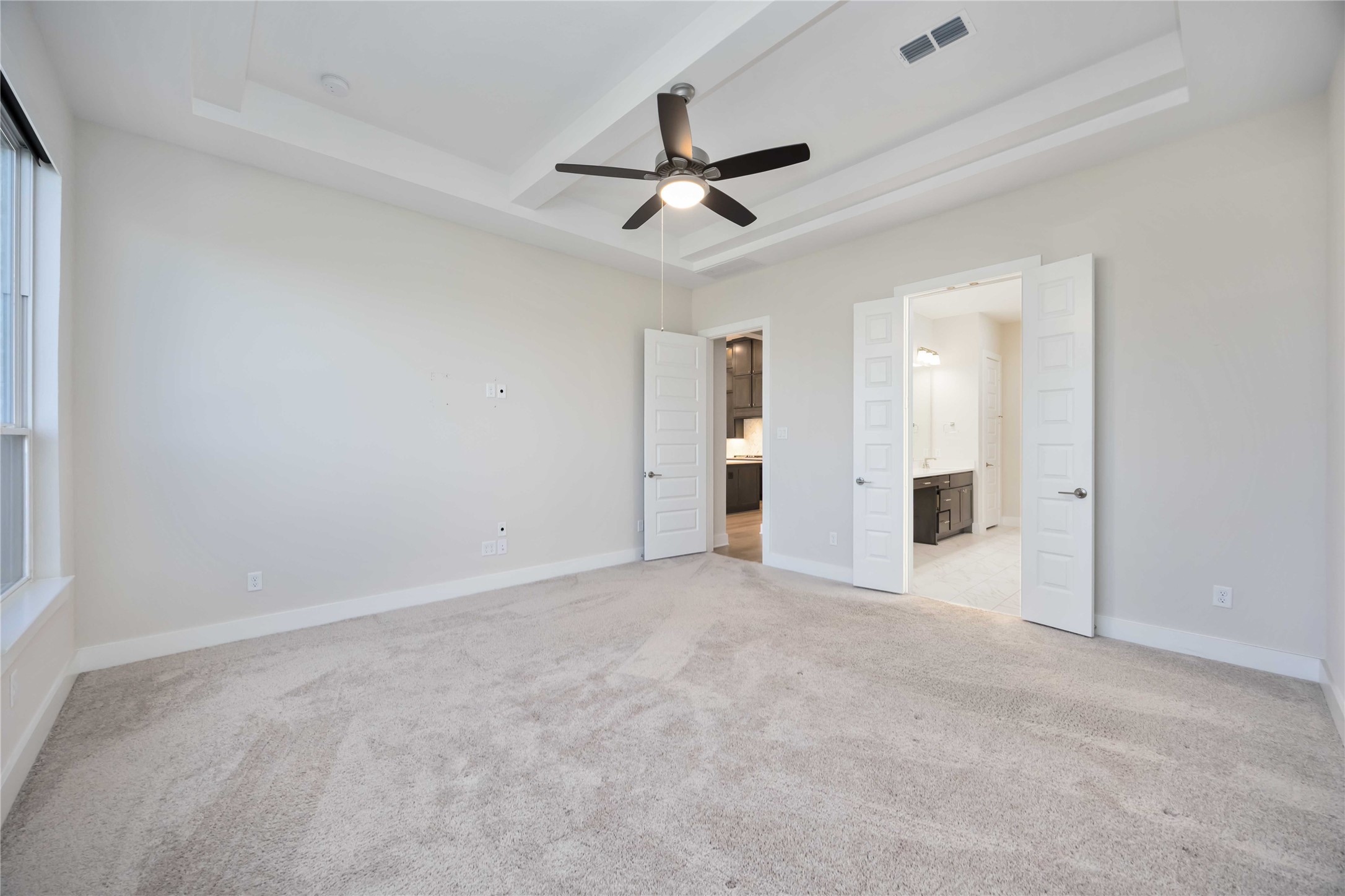 32022 Western Grv Lane Fulshear, TX 77441 - Photo 20 of 49 an empty room with chandelier fan and windows