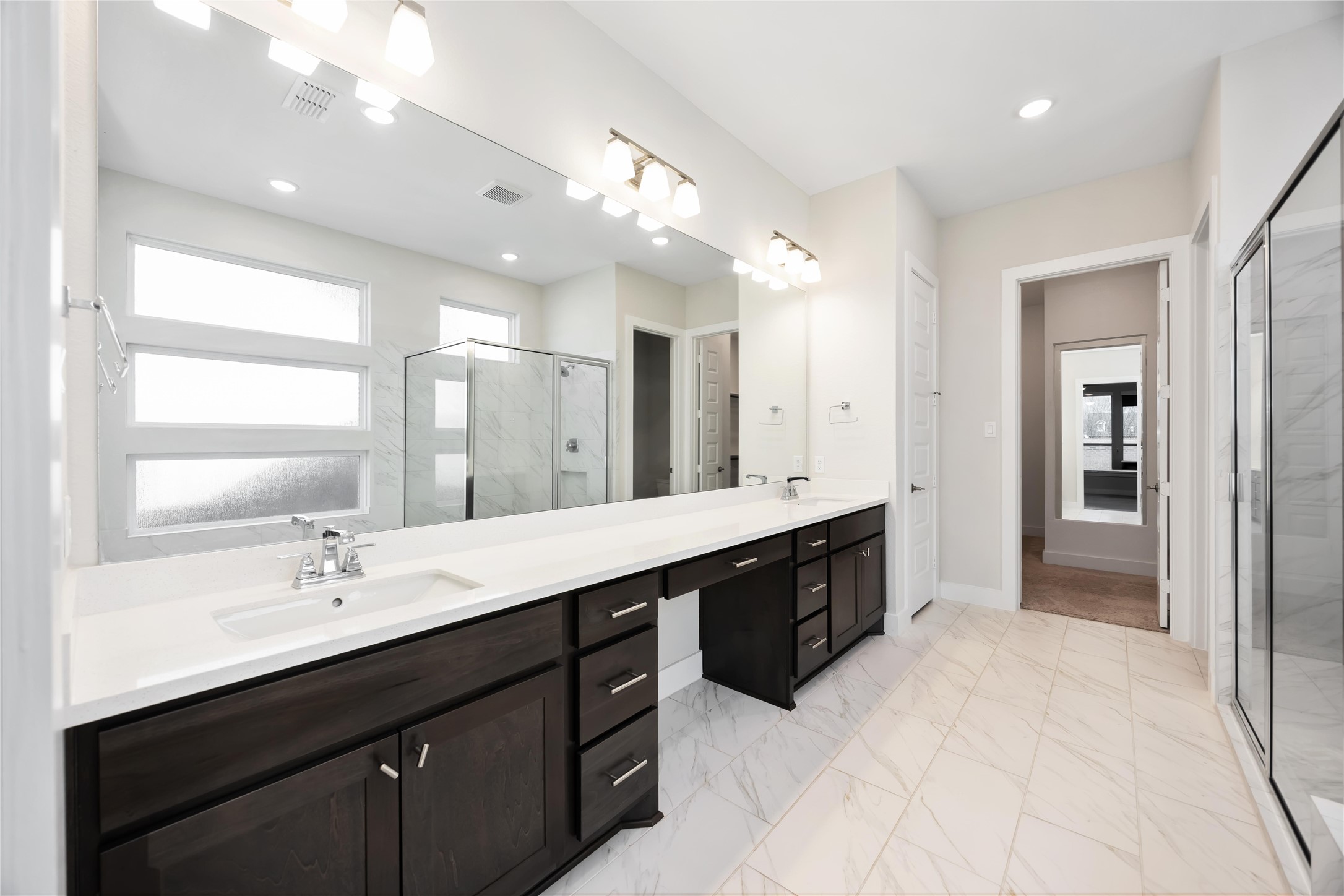 32022 Western Grv Lane Fulshear, TX 77441 - Photo 21 of 49 a large bathroom with a sink double vanity and a mirror