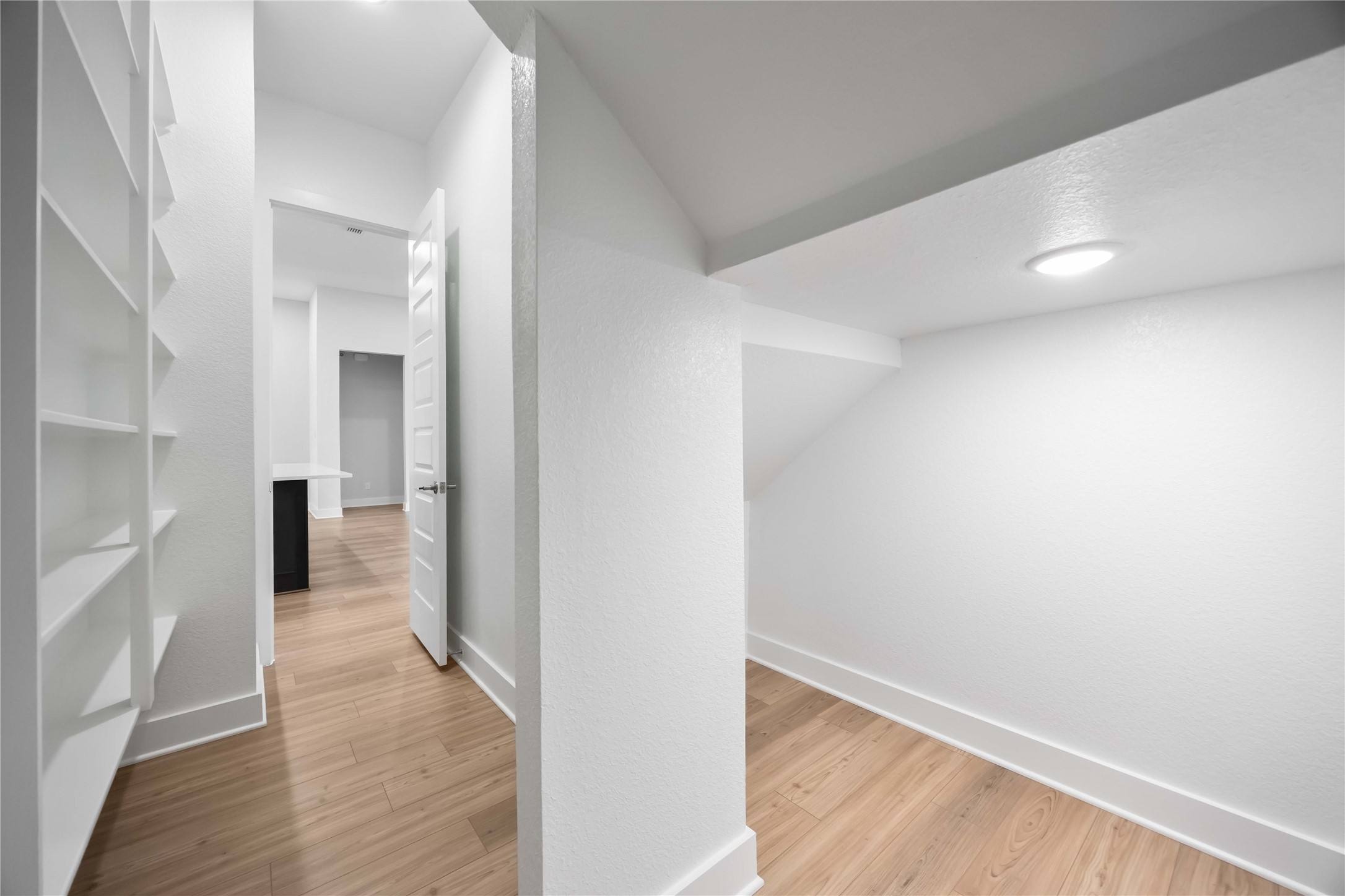 32022 Western Grv Lane Fulshear, TX 77441 - Photo 27 of 49 a view of a hallway view with wooden floor and staircase