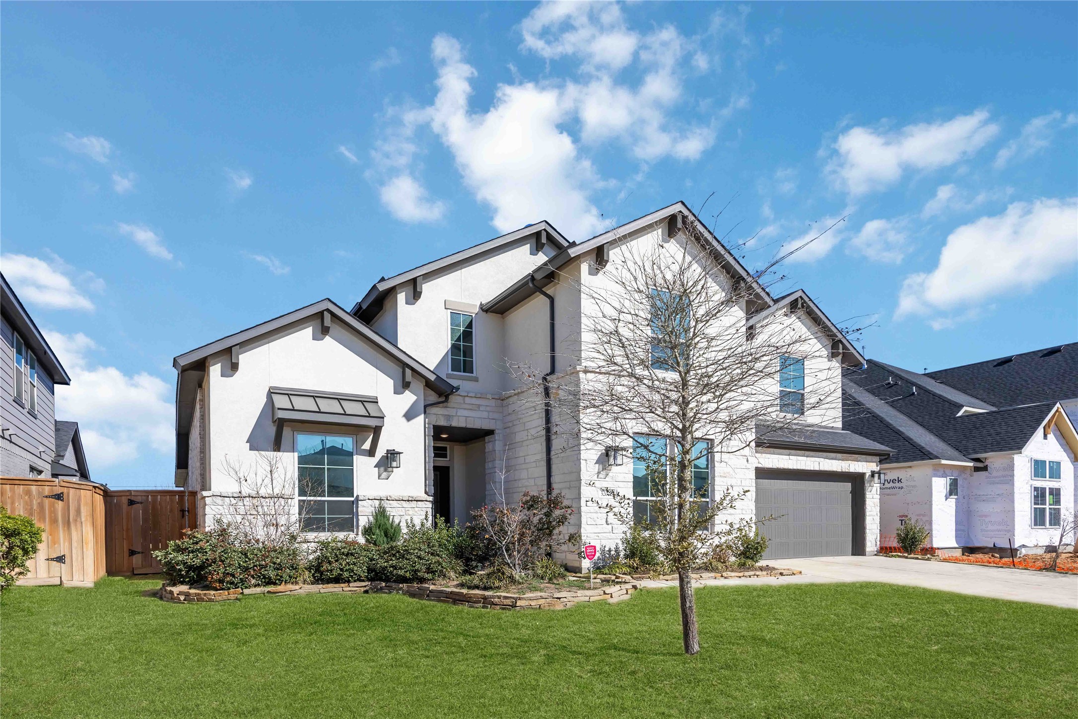 32022 Western Grv Lane Fulshear, TX 77441 - Photo 3 of 49 a front view of house with a garden