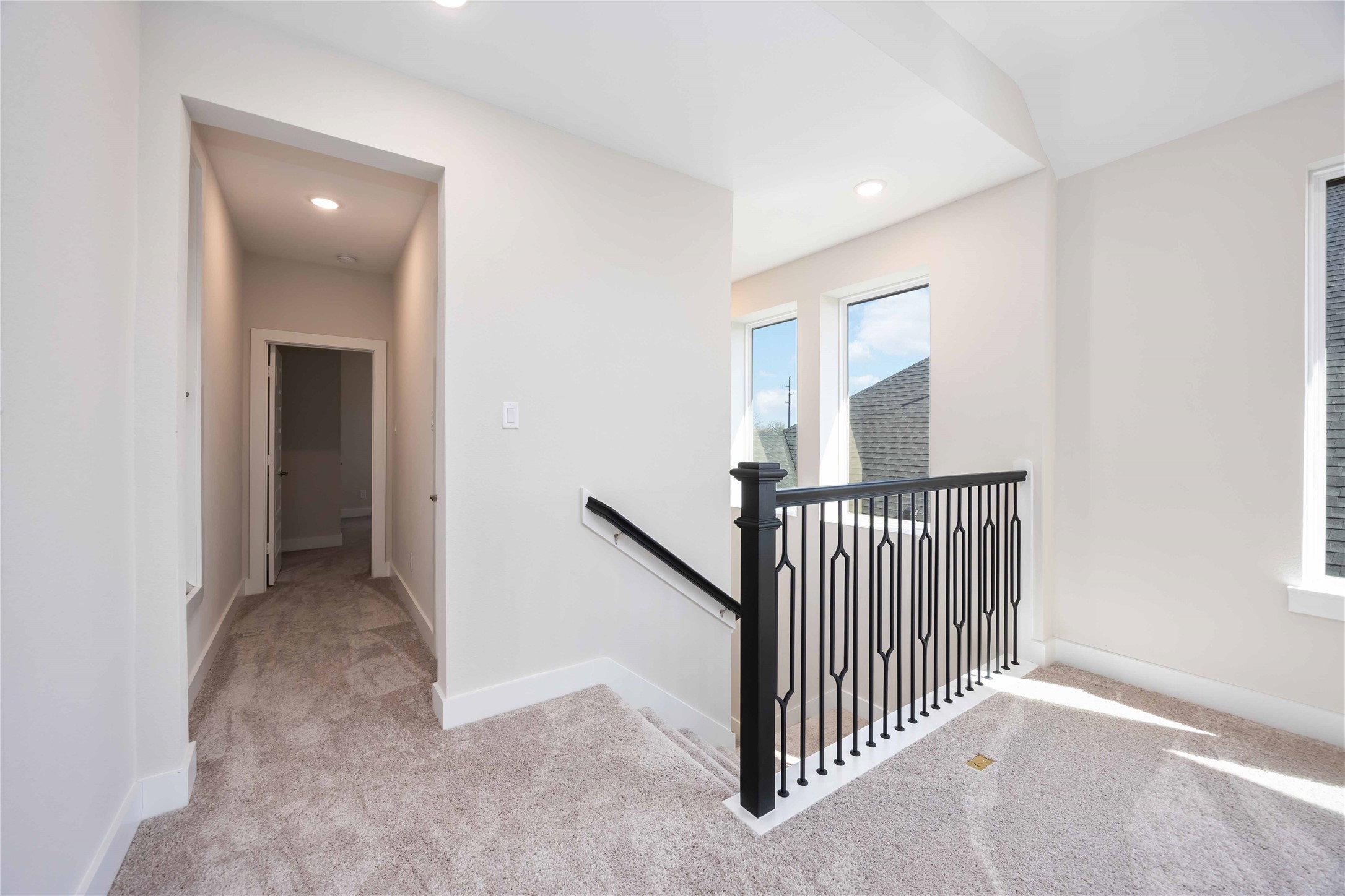 32022 Western Grv Lane Fulshear, TX 77441 - Photo 32 of 49 a view of a hallway with windows